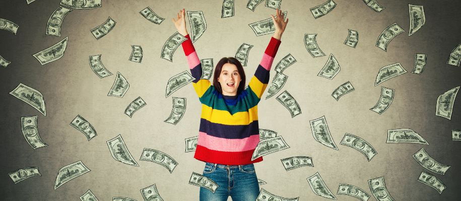White female in striped sweater with hands in air, surrounded by flying money