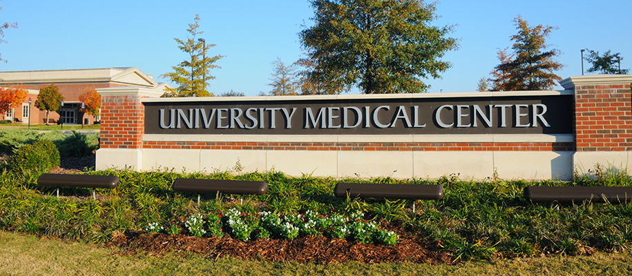 Sign on campus reading university medical center with nice landscaping