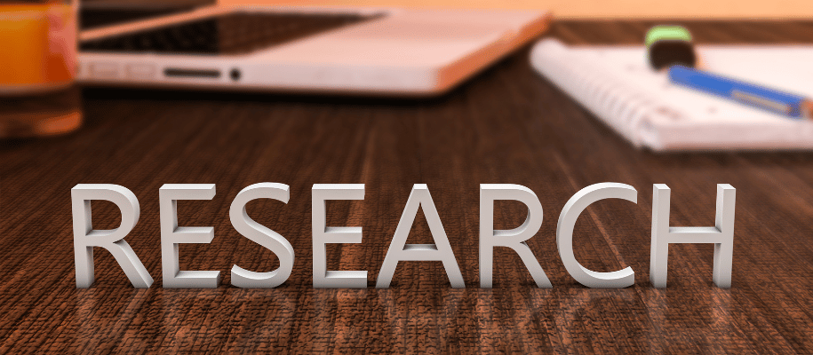 3D Letters spelling "research" on top of a desk