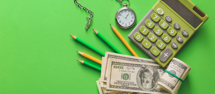 Calculator, stopwatch, pencils, and $100 bills against bright green backdrop