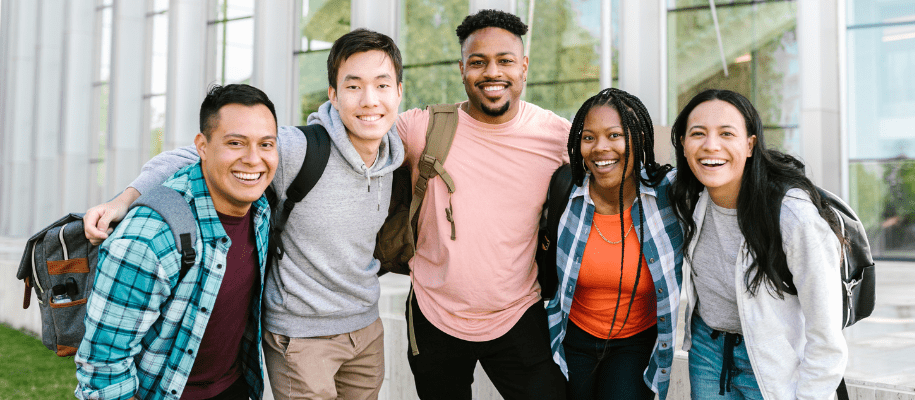 Hispanic male, Asian male, Black male & two Black females posing for camera