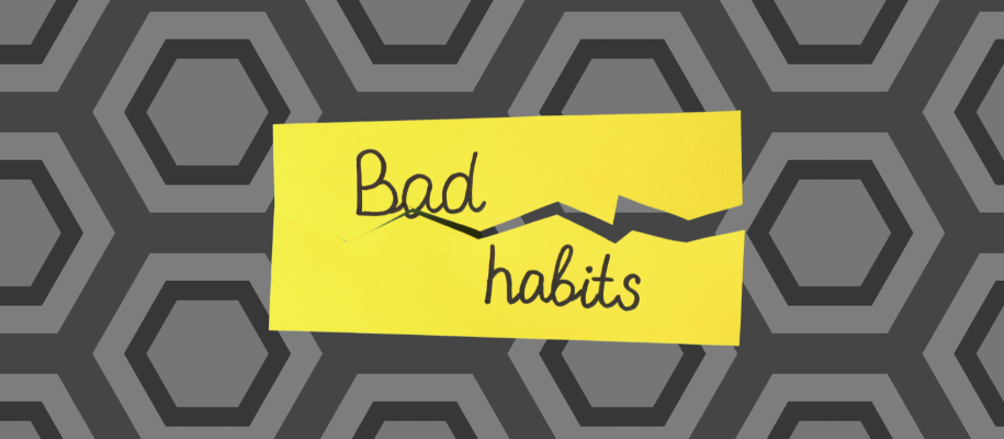 Bad Habits written on a Post-It note, ripped in half to indicate breaking habits