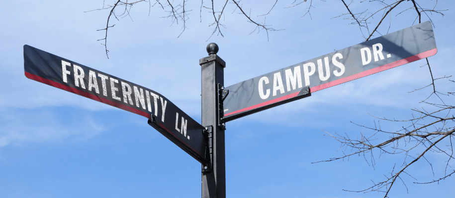 Street sign that reads, Fraternity Ln. and Campus Dr.