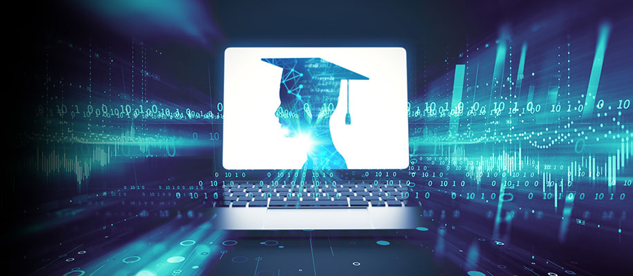 Laptop with graduate's silhouette against blue technology code background