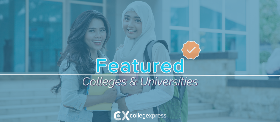 Two women, one in White hijab, campus building behind, featured schools logo