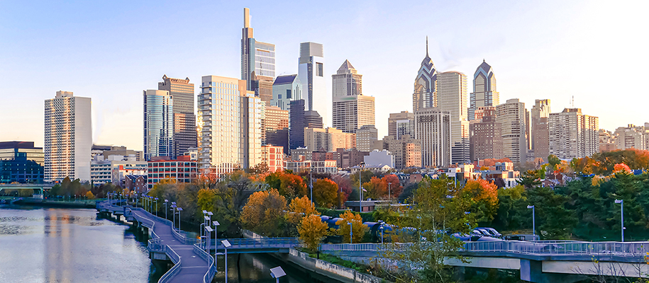 Skyline of Philadelphia, Pennsylvania in daytime and fall, with colored trees