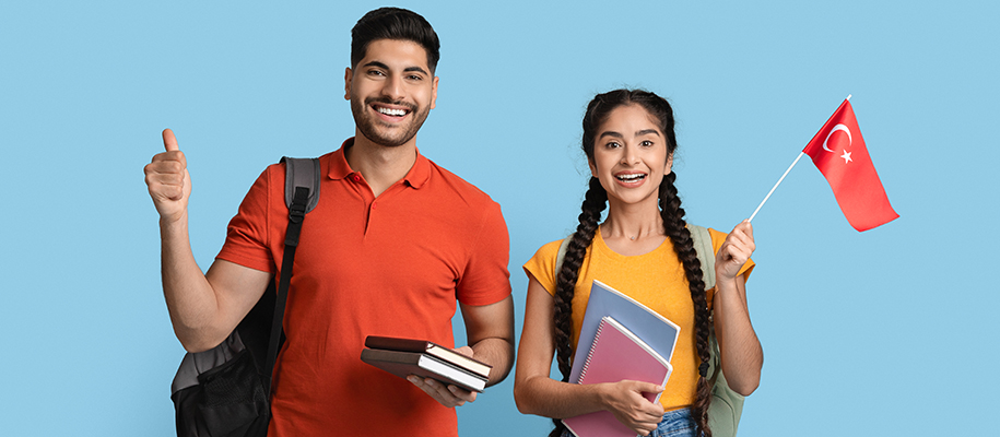 Male and female international students with Turkey flag, books, backpacks