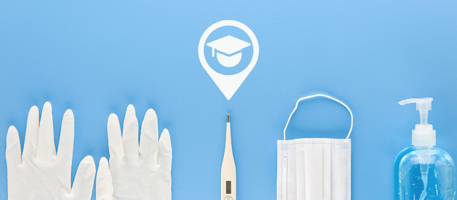 Gloves, thermometer, facemask, sanitizer on blue backdrop, grad cap location pin