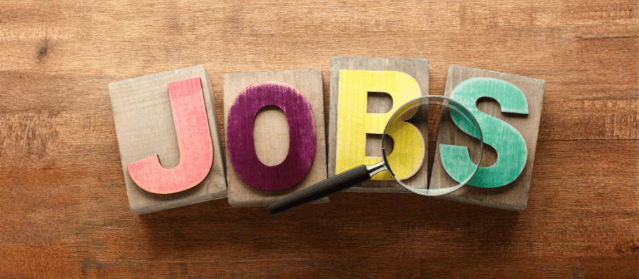 Alpha blocks spelling JOBS and a magnifying glass