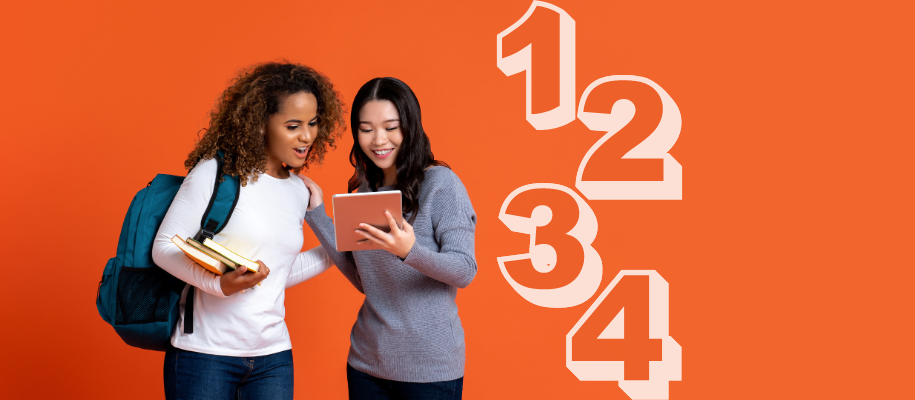 Young Black and Asian women look at tablet on orange backdrop next to 1234