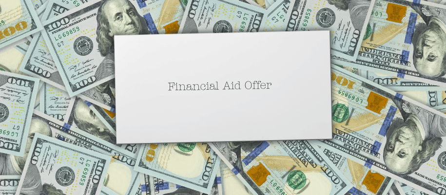 Envelope labeled, "Financial Aid Offer," lays on top of $100 bills