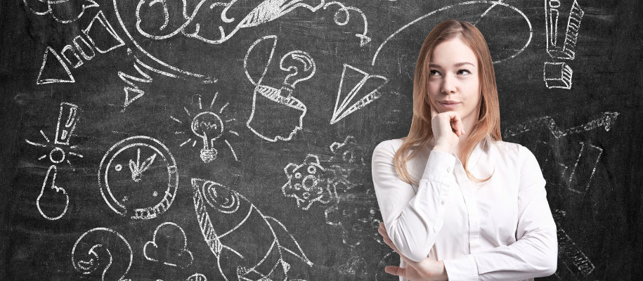 White blonde student thinking next to chalkboard with school-related doodles