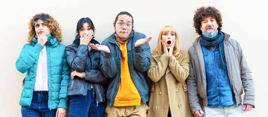 Diverse group of five young adults making faces, covering mouth, shrugging