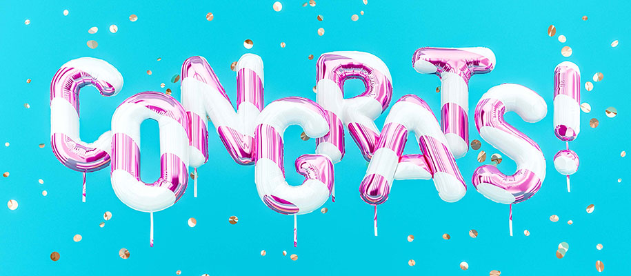 Balloon letters spelling Congrats! against blue background with gold confetti