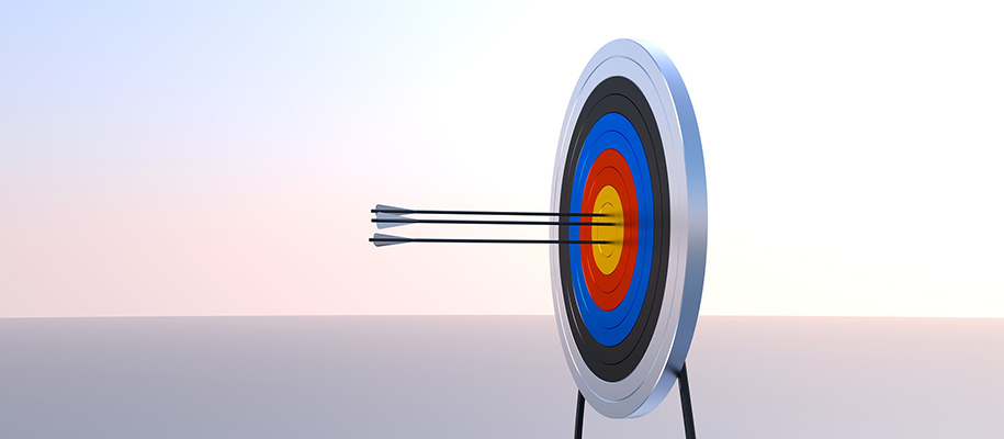 white, black, blue, red, and yellow colored target with three arrows in center