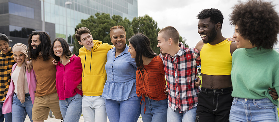 Line of diverse students in colorful clothing with arms around each other