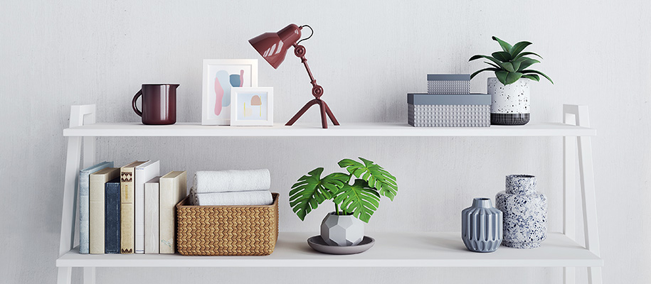 Top of white bookshelf decorated with lamp, plants, boxes, books, and more