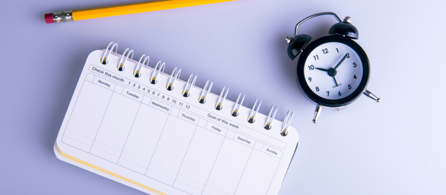 close-up of daily planner with blue highlights and a ?make it happen? message