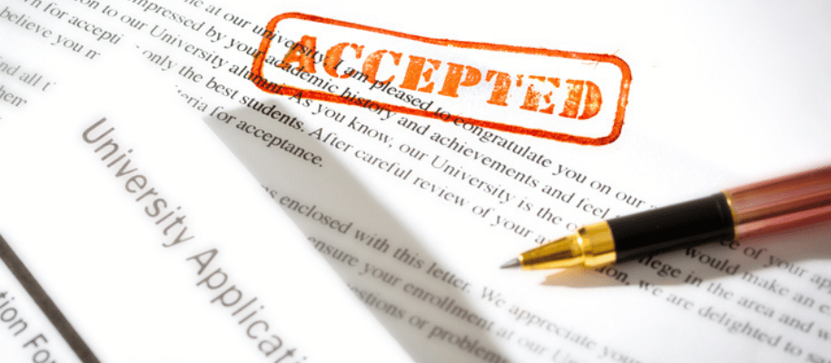 Close up image of a university application with "accepted" stamped on it