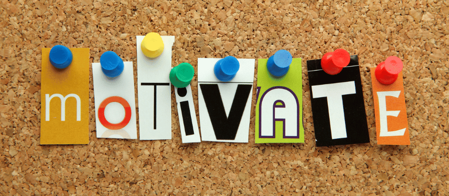 the word "motivate" pinned to a bulletin board