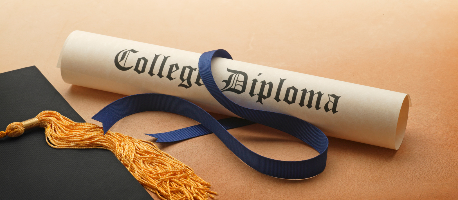 Paper tube reading College Diploma, untied blue ribbon, grad cap, yellow tassel