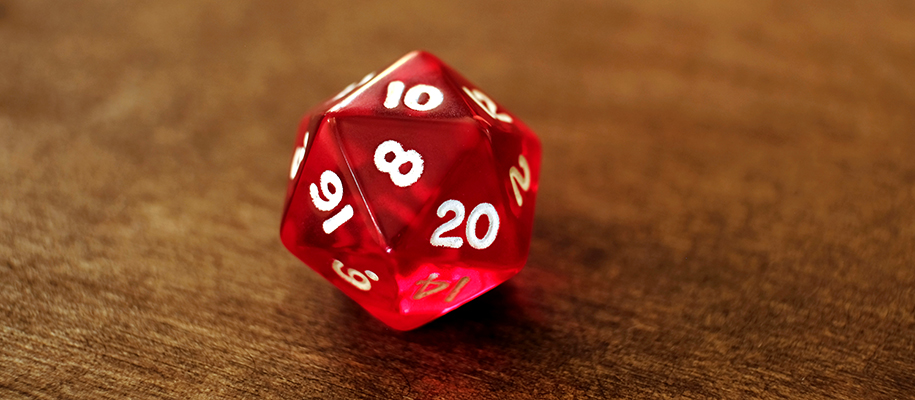 Red D20 die with 10 facing up, 8 facing camera, on dark wood table