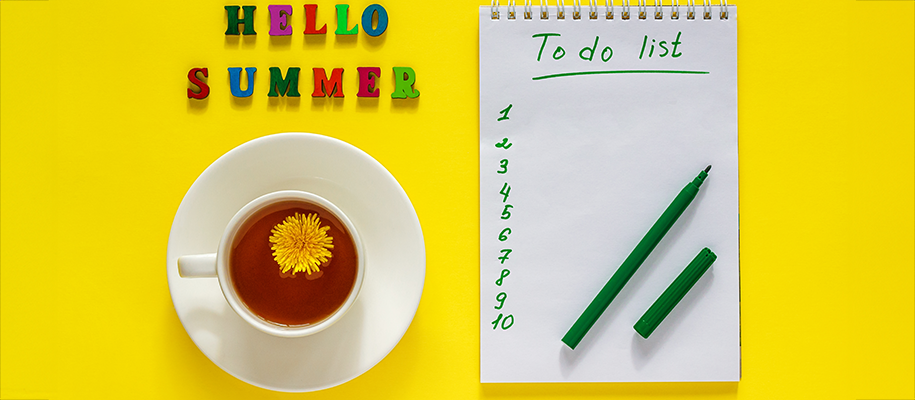 Cup of tea with daisy floating in it next to 1–10 to-do list and green marker