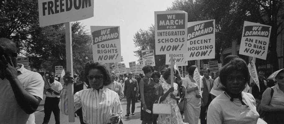 Historical black/white shot of Blacks marching for equal rights, integration