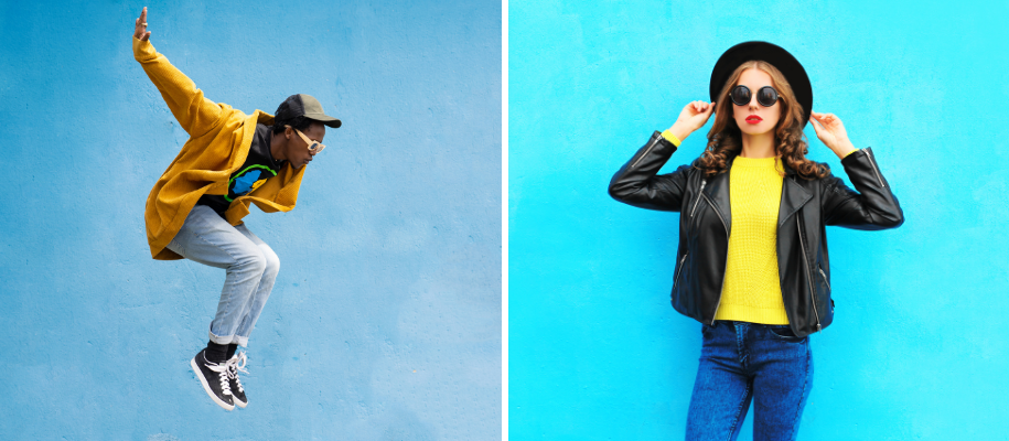Black man in yellow sweatshirt jumping, White woman in leather jacket and hat