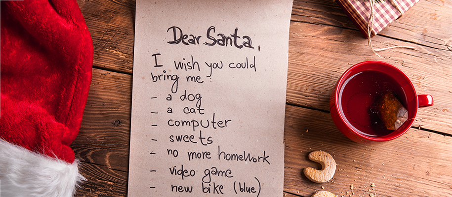 Wishlist for Santa with gift, Santa hat, cup of tea, and cookies